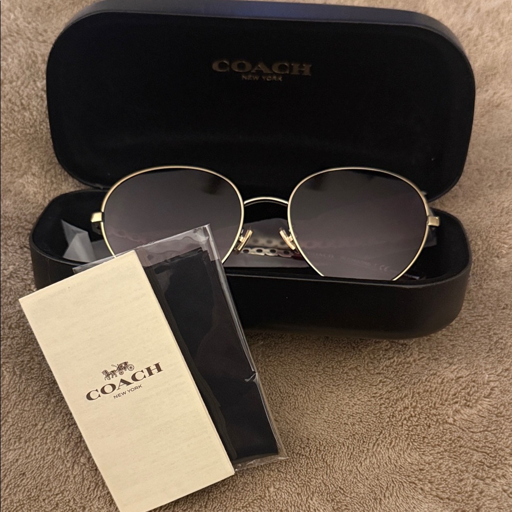 Coach Women's Sunglasses with Gold Frame and Black Lenses